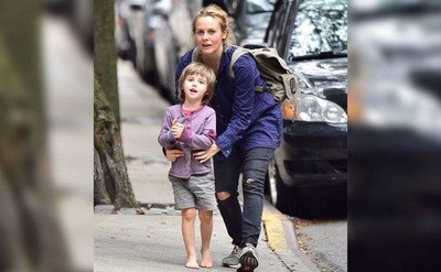 A sporty and casual Alicia Silverstone and her barefoot son Bear are seen in the streets of New York City.